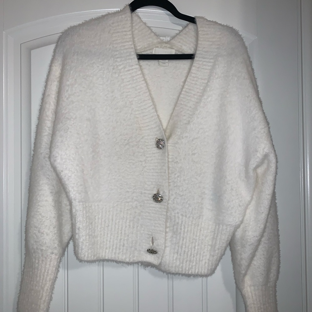 White fuzzy sweater with jewel buttons